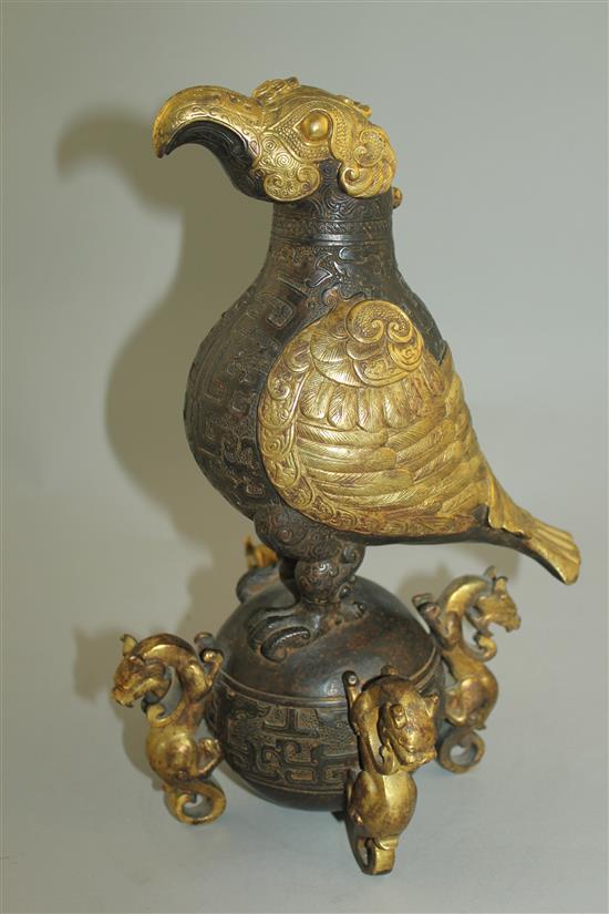 A Chinese part gilt bronze model of an eagle, in Han dynasty style, 29.5cm